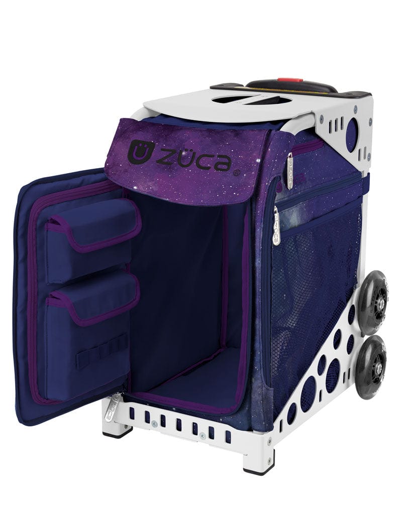 Zuca Sport skating bag Insert Bag for the Zuca frame with wheels is named Fairy Dust has a deep purple and navy cosmic background the front zippered door flap is open and reveals a navy interior with a purple trim. There are 2 storage pockets on the inside door flap. This insert is paired with a white frame which is sold separately.